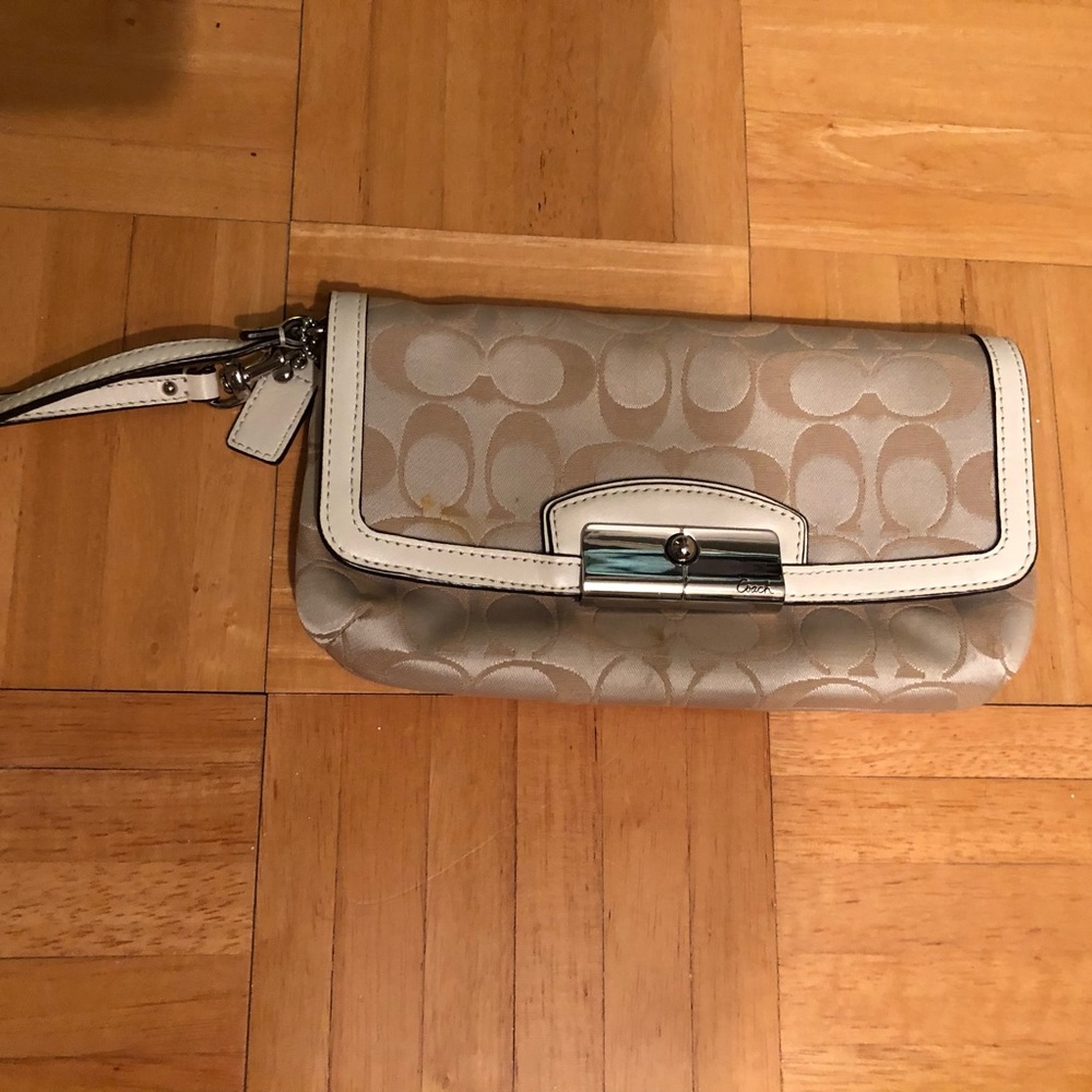 Coach wristlet, medium size, light tan color.